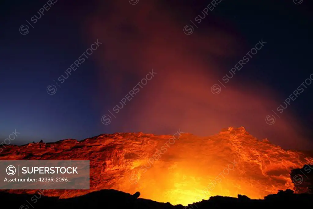 January 30, 2011 - Lava lake illuminating walls of pit crater at nightfall, Erta Ale volcano, Danakil Depression, Ethiopia.