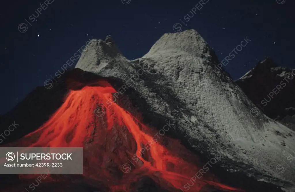 July 2004 - Nighttime eruption of natrocarbonatite lava flows from hornito at Ol Doinyo Lengai volcano, Tanzania, Africa.