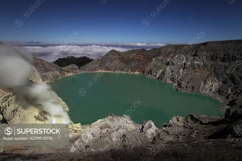August 12, 2011 - Crater of Kawah Ijen volcano containing highly acidic crater lake and solfatara (bottom left) with blue sulphur flames, Java, Indonesia.