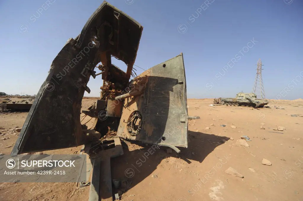 A tracked artillery vehicle destroyed by NATO forces in the desert just outside Benghazi, Libya.  A war betwean Gaddafi army and Libya's Transitional National Council army with air support from NATO started on March 17, 2011.