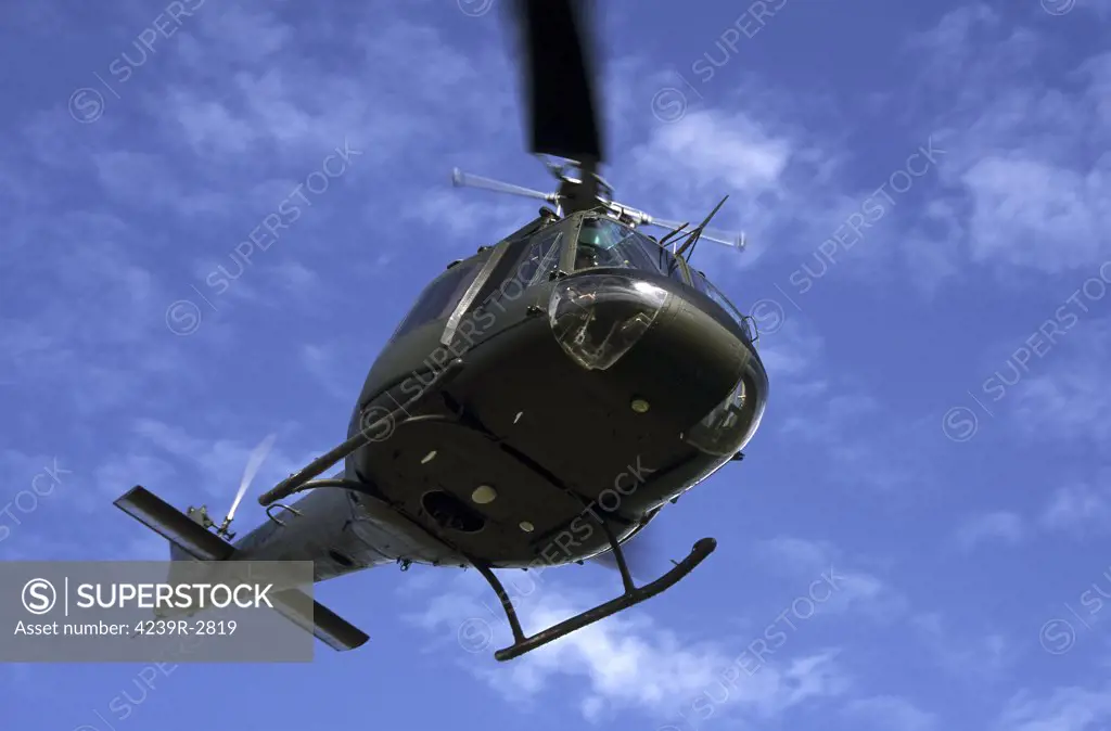 Former U.S. Air Force Bell UH-1E Huey helicopter in flight.