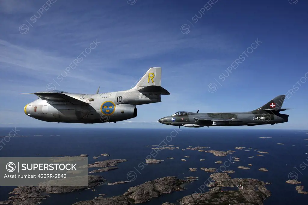 Bohuslan, Sweden - Saab J 29 Flying Barrel and Hawker Hunter vintage jet fighters of the Swedish Air Force Historic Flight.