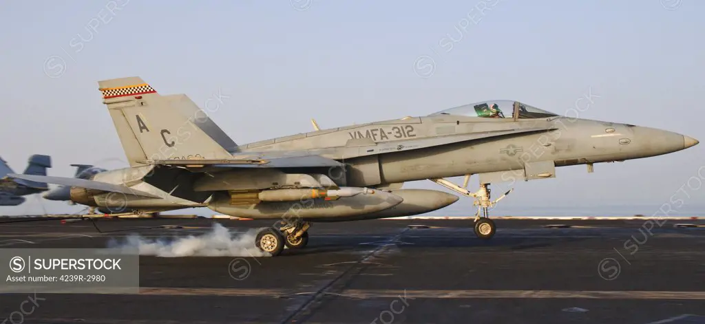An F/A-18 Hornet assigned to VMFA-312 lands aboard USS Harry S. Truman after a mission over Afghanistan.