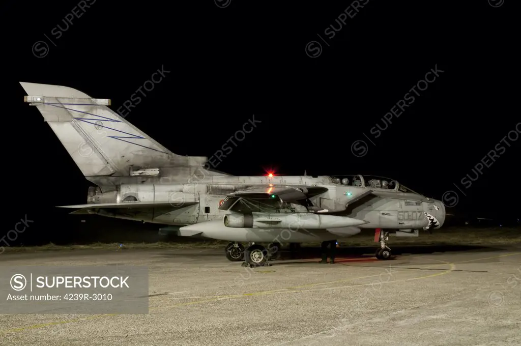 A Panavia Tornado ECR of the Italian Air Force prepares for a night mission on the ramp of Piacenza Air Base, Italy.