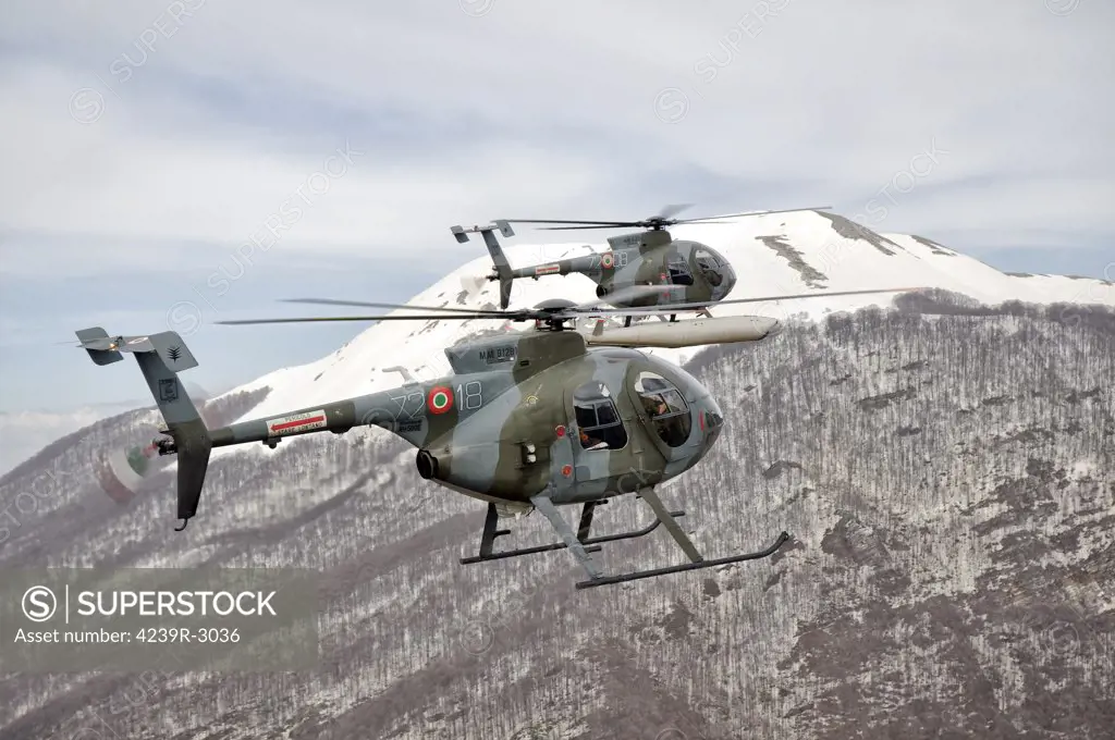Two Breda Nardi NH-500E helicopters of the Italian Air Force 72nd Wing fly over Frosinone, Italy. The main component of the 72nd Stormo is the 208th Gruppo (Squadron), a flight unit whose courses were attended by more than 4,000 pilots in 40 years, proof that almost every Italian military pilot flying with the choppers earned their wings at Frosinone. However, even if the training role continues to be the main role of the 208th Gruppo, its crews are often involved in real operations abroad.