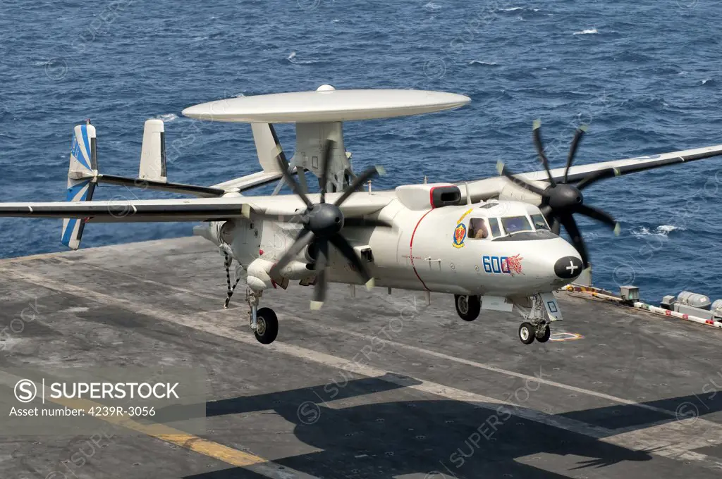 A US Navy E-2C Hawkeye descends to make an arresting gear landing aboard USS Eisenhower. Eisenhower is operating in the 5th fleet area of responsibility off the coast of Pakistan.
