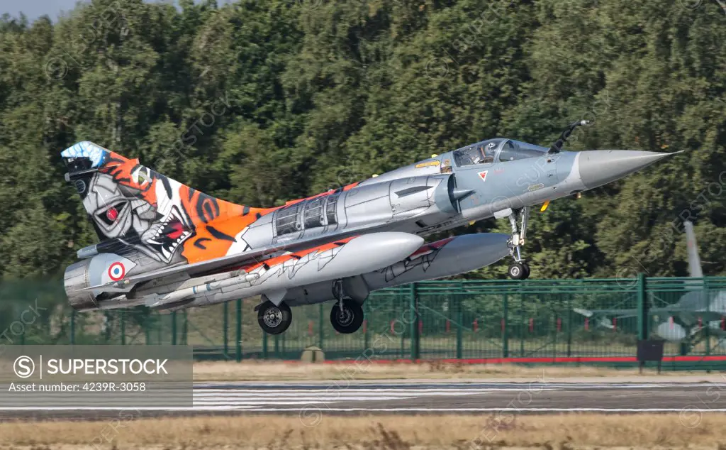A French Air Force Mirage 2000 lands on the runway at Kleine Brogel Air Base, Belgium, during Tiger Meet 2009.