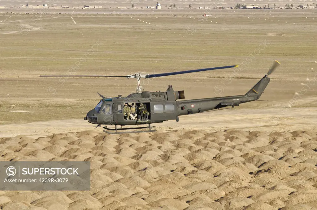Italian Army AB-205MEP utility helicopter in flight over Shindand, Afghanistan, in support of the International Security Assistance Force (ISAF) mission.