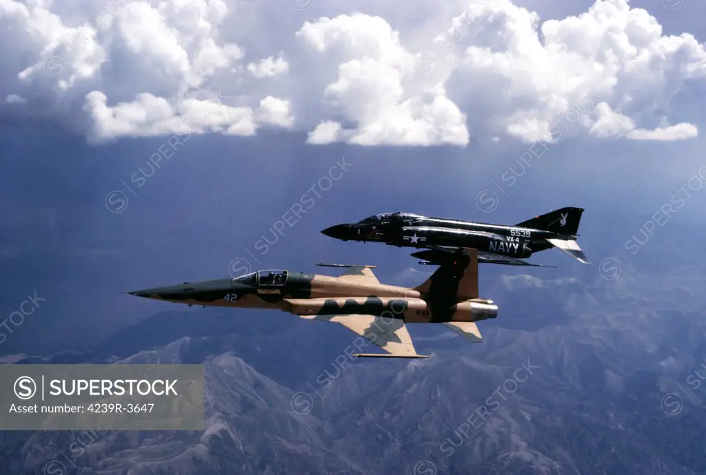 U.S. Navy Fighter Weapons School (TOPGUN) F-5E Tiger II and Test and Evaluation Squadron FOUR (VX-4) F-4 Phantom II during a tactics development flight near NAS Fallon, Nevada.