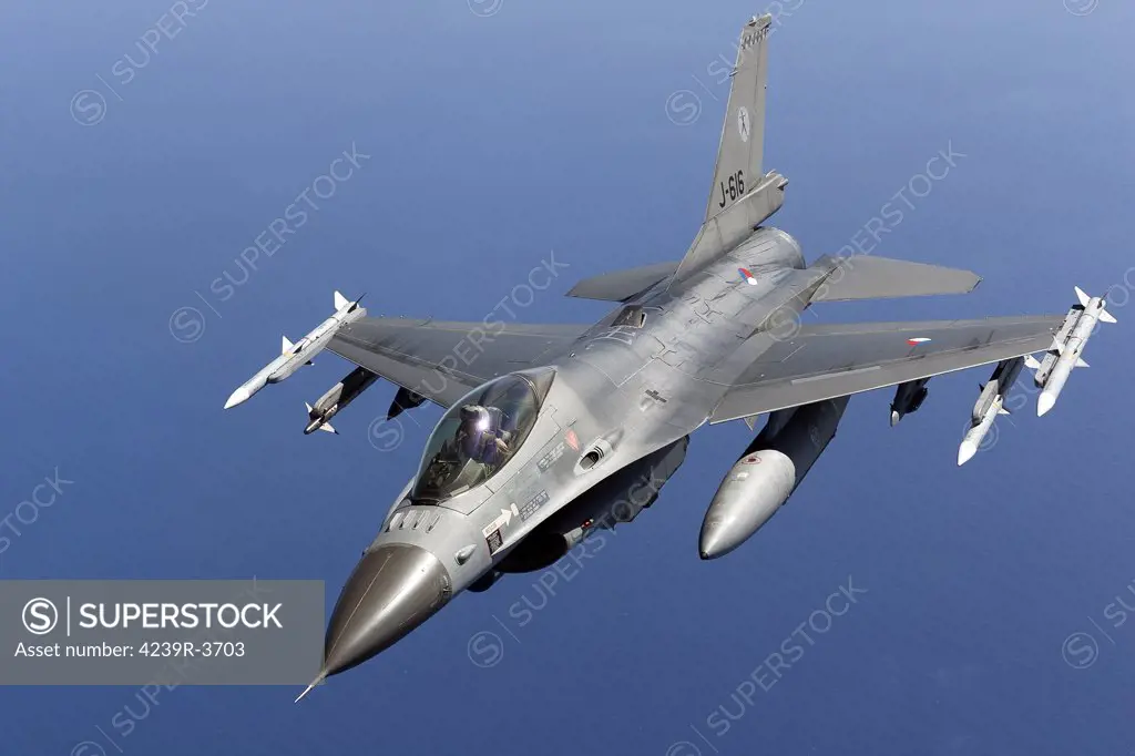 April 8, 2011 - A Dutch F-16AM armed with AIM-120 AMRAAM and AIM-9 Sidewinder missiles during a combat air patrol sortie in support of Operation Unified Protector over the Mediterranean Sea close to Libya.
