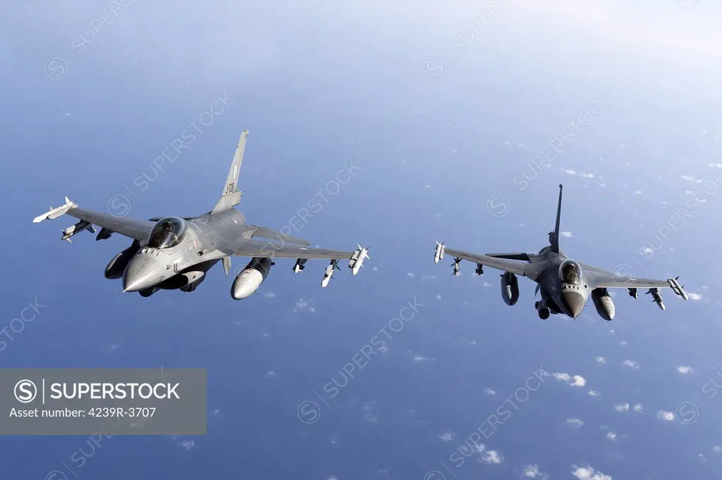 April 8, 2011 - Dutch F-16AMs armed with AIM-120 AMRAAM and AIM-9 Sidewinder missiles during a combat air patrol sortie in support of Operation Unified Protector over the Mediterranean Sea close to Libya.