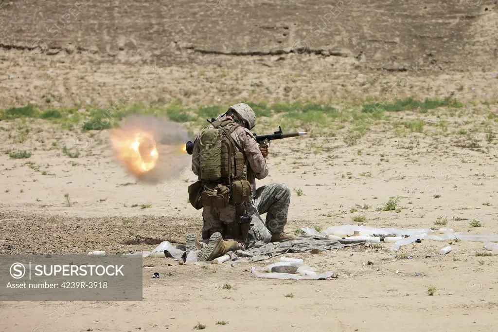 U.S. Army soldier fires a high-explosive fragmentation round from the RPG-7 rocket-propelled grenade launcher in a wadi near Kunduz, Afghanistan.
