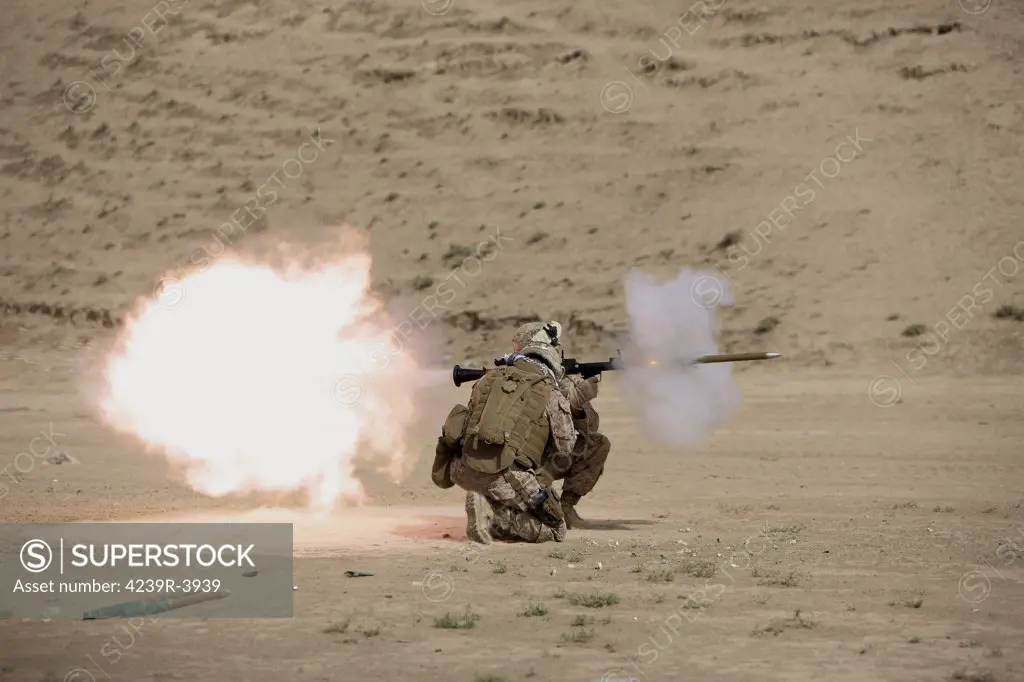 U.S. Marine fires a HE fragmentation round from the RPG-7 rocket-propelled grenade launcher in a wadi near Kunduz, Afghanistan.