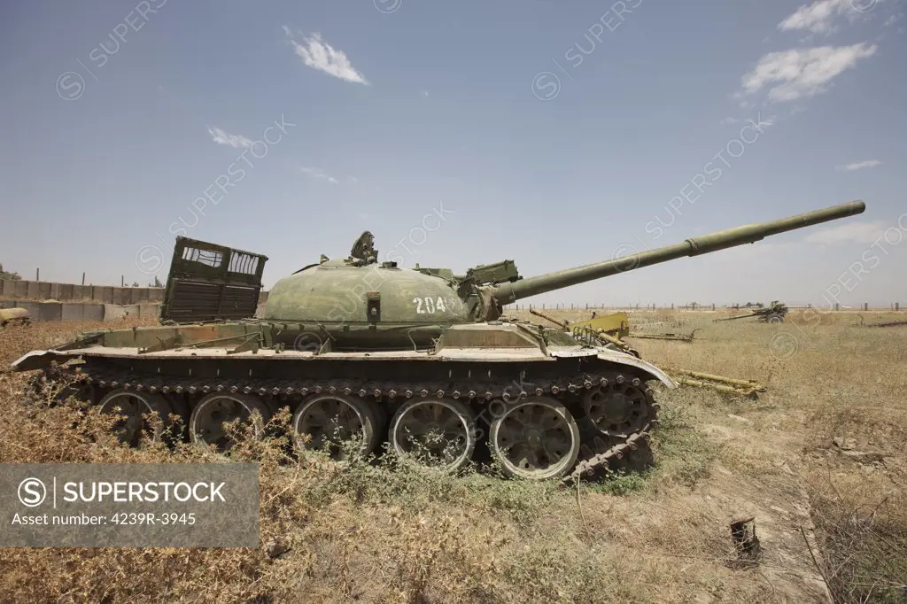 A Russian T-62 main battle tank rest in an armor junkyard in Kunduz, Afghanistan.