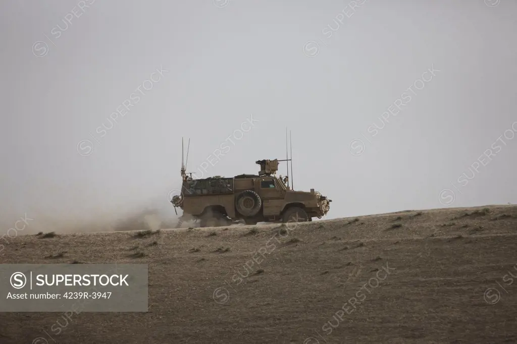 An MRAP vehicle patrols the ridge of a wadi near Kunduz, Afghnanistan.
