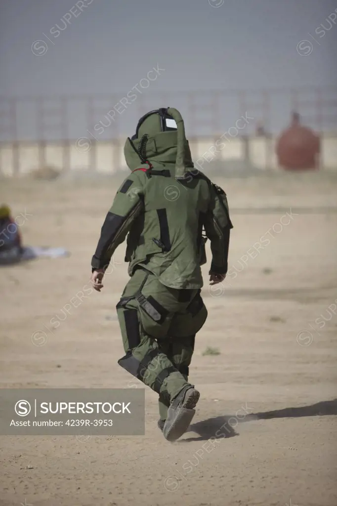 Kunduz, Afghanistan - A U.S. Marine tries running in a German Army EOD blast suit.