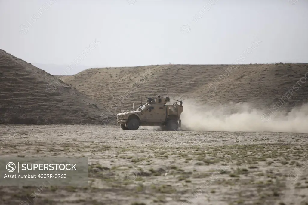 An M-ATV races across the wadi near Kunduz, Afghanistan.