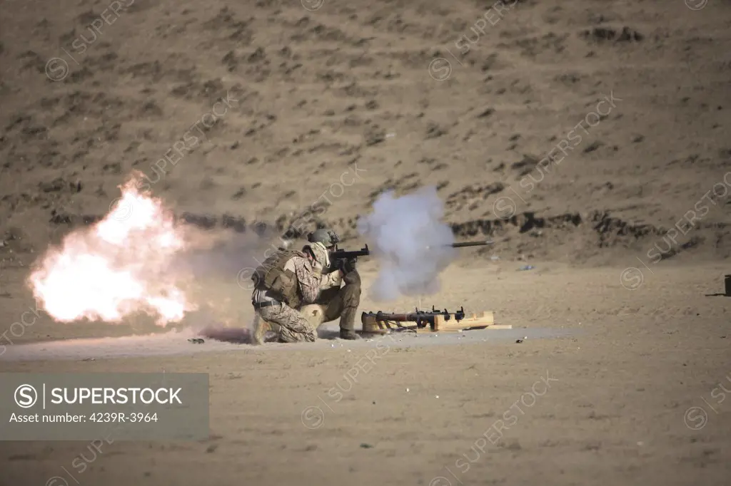U.S. Navy EOD soldier fires a HE fragmentation round from the RPG-7 rocket-propelled grenade launcher in a wadi near Kunduz, Afghanistan