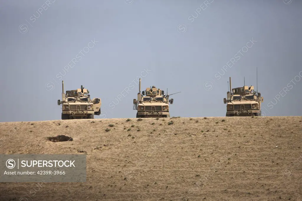 Three M-ATV's guard the top of the wadi near Kunduz, Afghanistan.