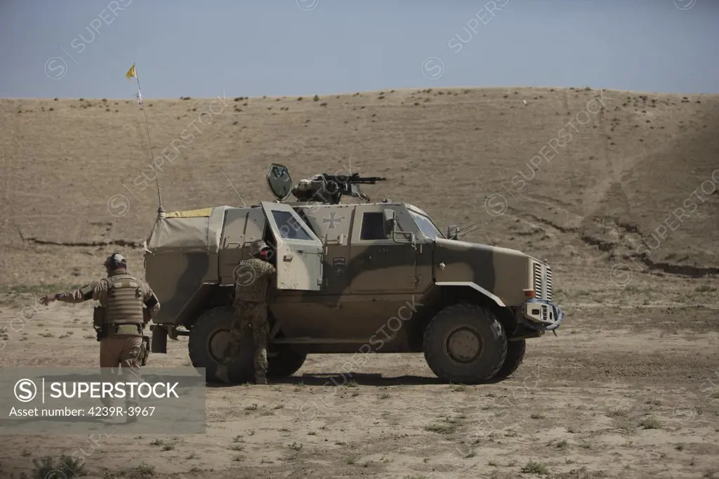 Kunduz, Afghanistan - The German Army ATF Dingo with a turret mounted Rheinmetall MG3 is a German heavily armored military infantry mobility vehicle, simialr to the American MRAP. It has a V-hull design to deflect any IED blast to mimimalize damage to the troops within.