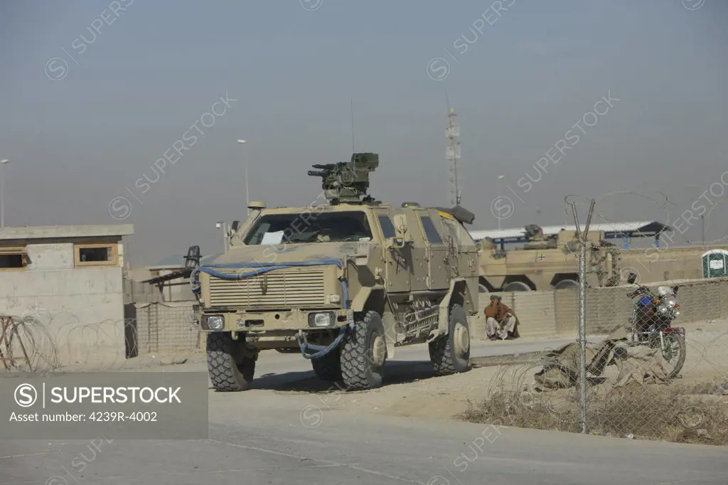 Kunduz, Afghanistan - The German Army ATF Dingo with a turret mounted Rheinmetall MG3 is a German heavily armored military infantry mobility vehicle, simialr to the American MRAP. It has a V-hull design to deflect any IED blast to mimimalize damage to the troops within.