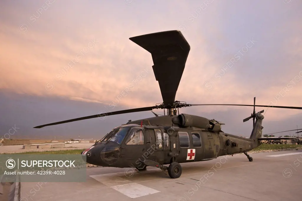 A UH-60L Black Hawk medevac helicopter parked on its pad at the German PRT in Northern Afghanistan.