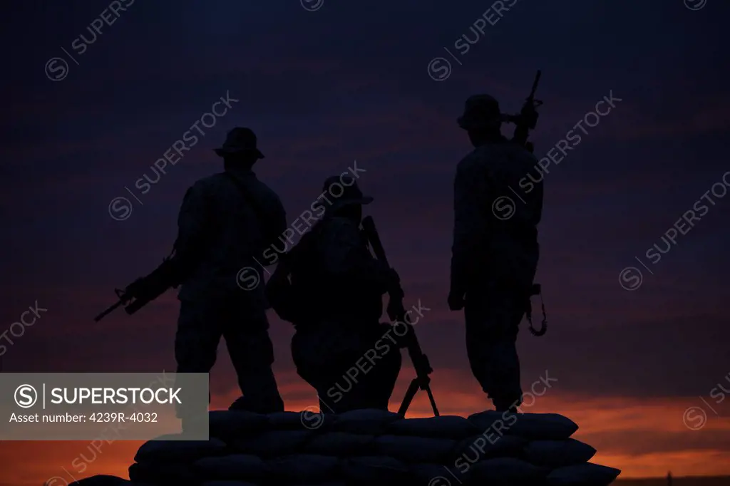 Silhouette of U.S Marines on a bunker at sunset in Northern Afghanistan.