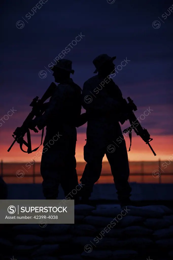 Silhouette of U.S Marines on a bunker at sunset in Northern Afghanistan.