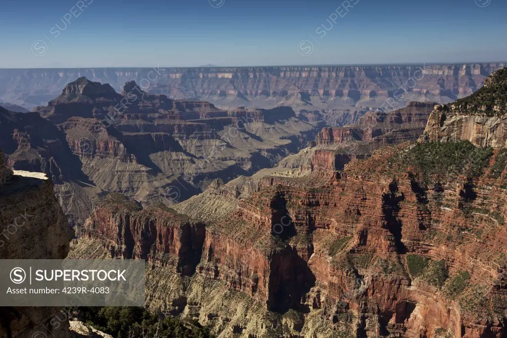 A view from Bright Angel Point near the North Rim Visitors Center looking towards the South Rim with Bright Angel Canyon stretching from the lower left of the image diagonally to the top right of the image