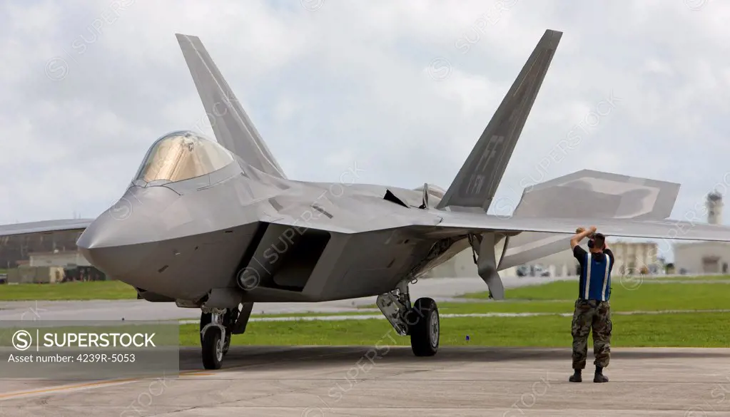 An F-22 Raptor from Langley Air Force Base, Virginia, goes through pre-flights checks before taking off on a training mission at Kadena Air Base, Okinawa, Japan.