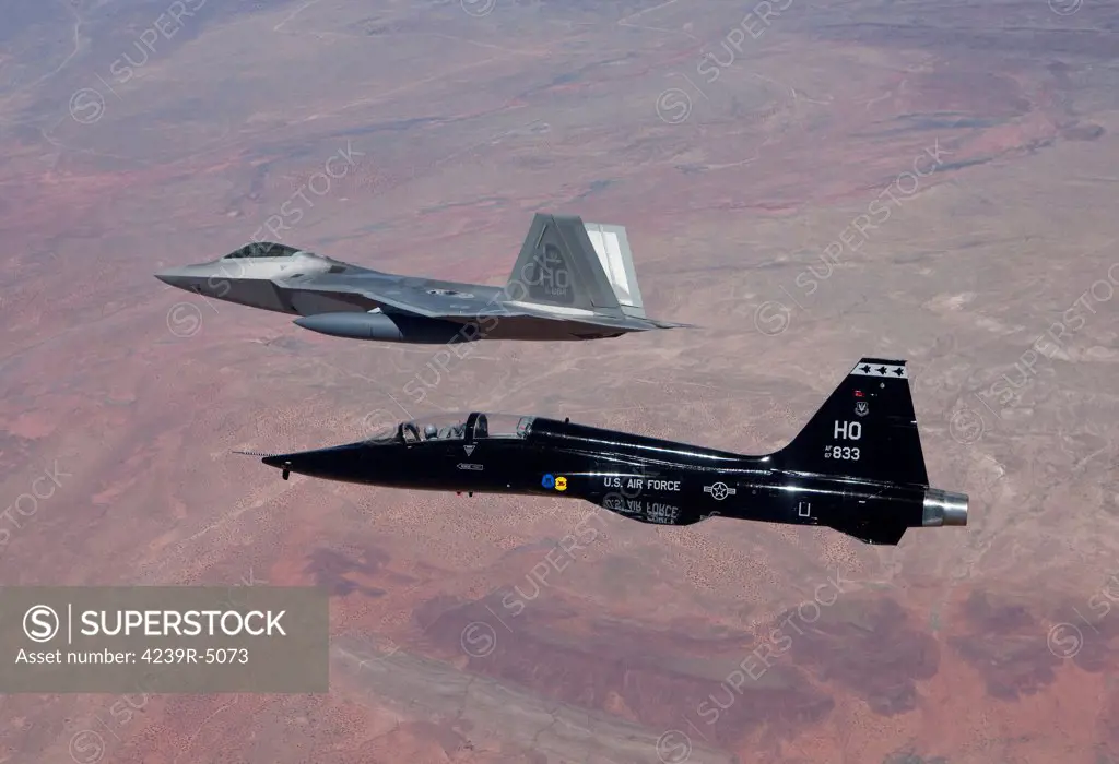 An F-22 Raptor from the 49th Fighter Wing flies in formation with a T-38 Talon while on a training mission out of Holloman Air Force Base, New Mexico.