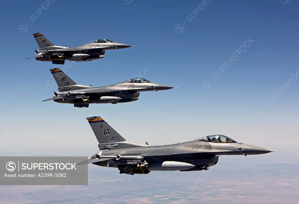 Three F-16's from the Air National Guard Air Force Reserve Test Center fly in formation during a test mission out of Tucson International Airport, Arizona.