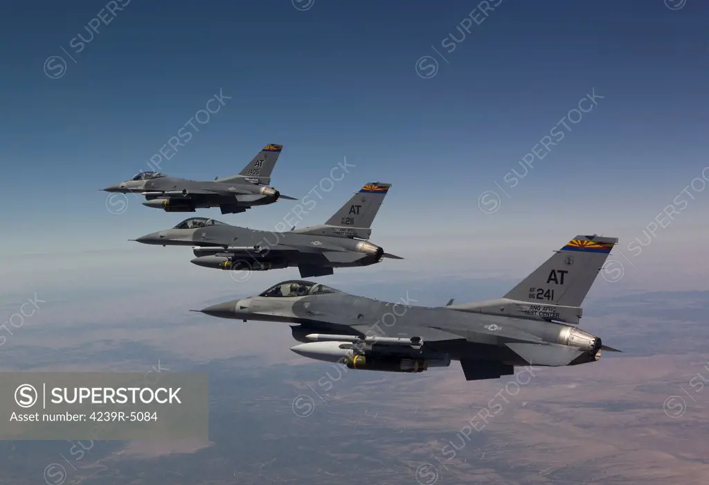 Three F-16's from the Air National Guard Air Force Reserve Test Center fly in formation during a test mission out of Tucson International Airport, Arizona.