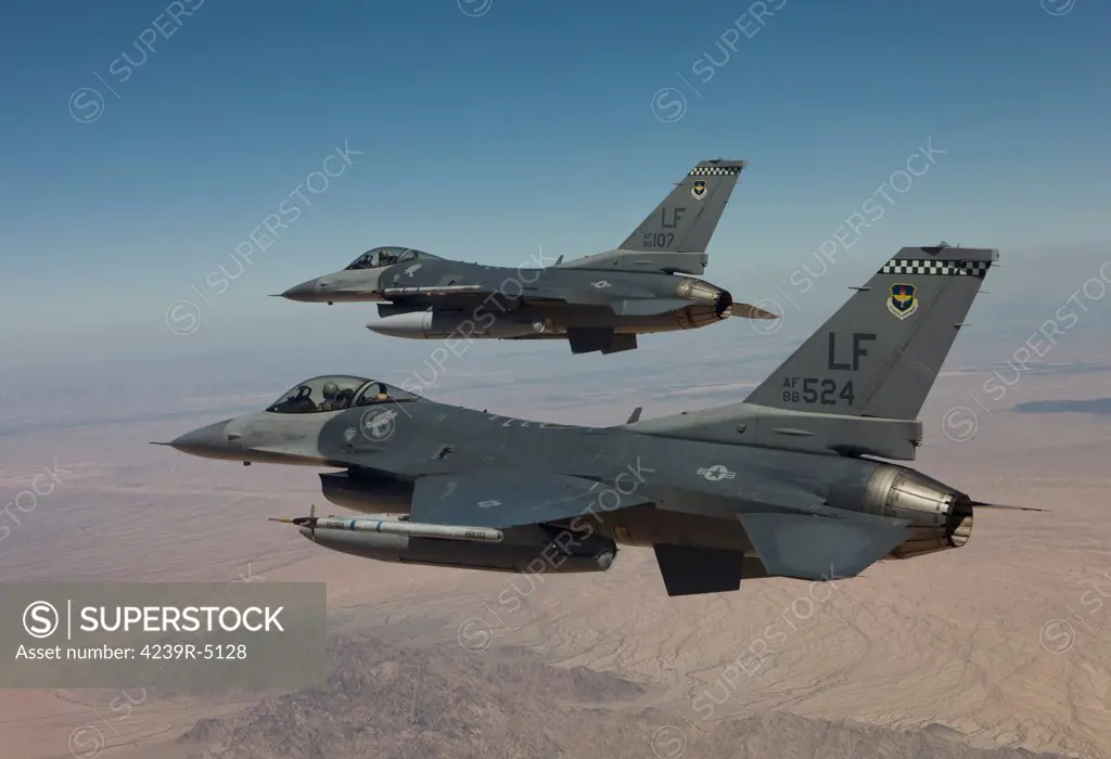 Two F-16's from the 56th Fighter Wing at Luke Air Force Base, Arizona, fly in formation over Arizona.