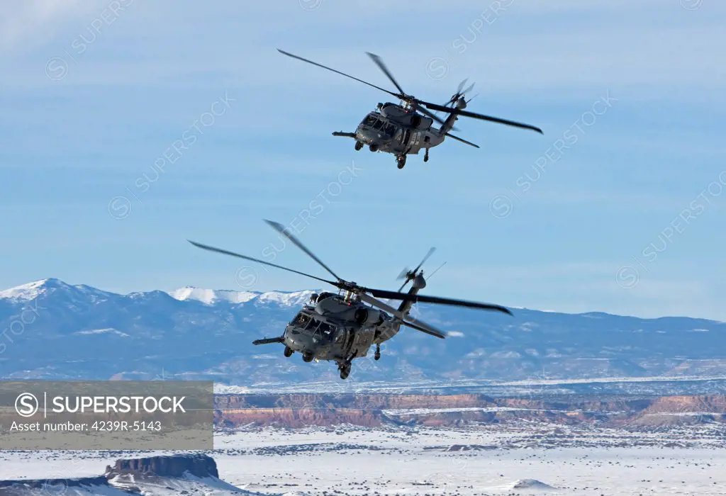 Two HH-60G Pave Hawk helicopters from the 512th RQS fly in formation during a training mission from Kirtland Air Force Base, New Mexico.