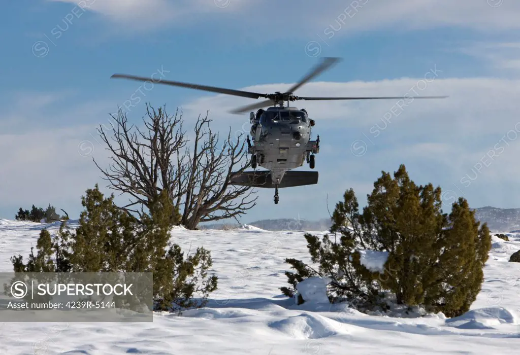 An HH-60G Pave Hawk from the 512th RQS fly's low over a landing zone during a training mission out of Kirtland Air Force Base, New Mexico.
