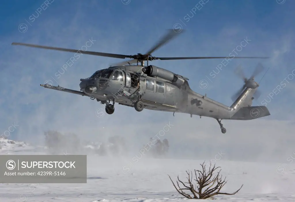 An HH-60G Pave Hawk from the 512th RQS fly's low over a landing zone during a training mission out of Kirtland Air Force Base, New Mexico.