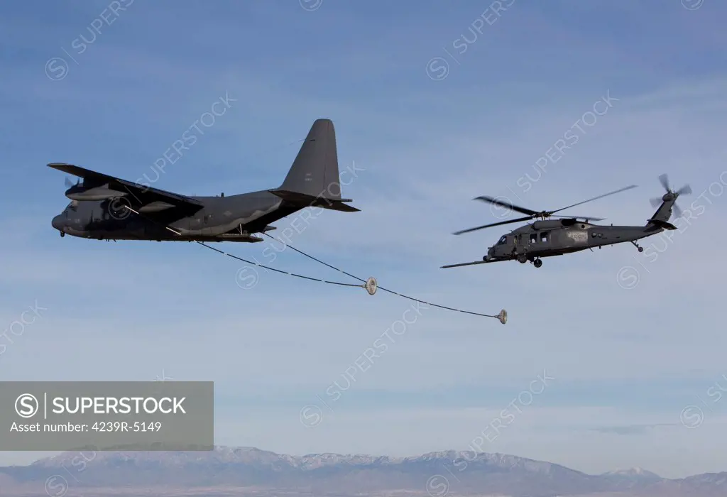 An HH-60G Pave Hawk from the 512th RQS prepares to conduct aerial refueling from an HC-130 during a training mission out of Kirtland Air Force Base, New Mexico.