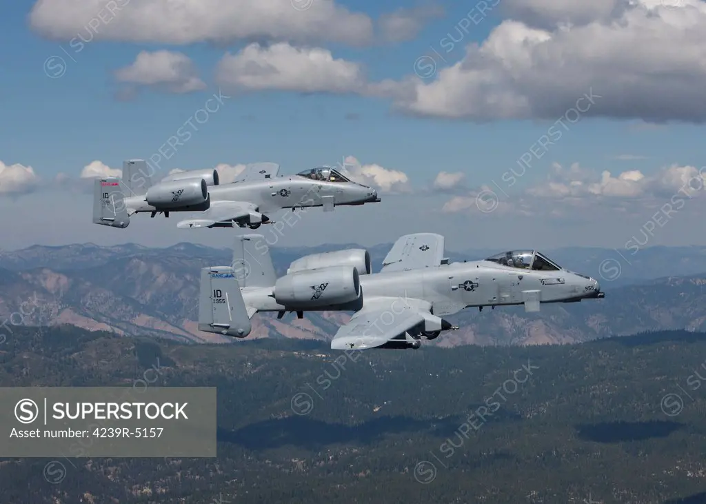 Two A-10 Thunderbolt's from the 124th Fighter Wing's 190th Fighter Squadron fly over the mountains in Central Idaho.