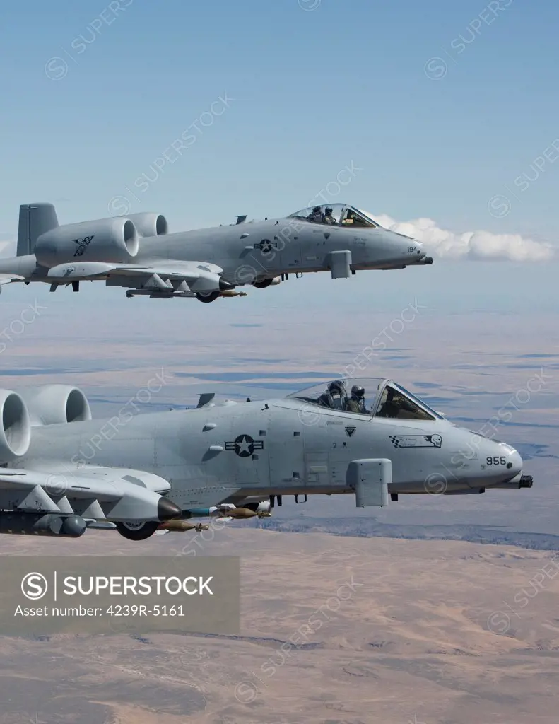 Two A-10 Thunderbolt's from the 124th Fighter Wing's 190th Fighter Squadron fly over the Saylor Creek bombing range in Central Idaho.