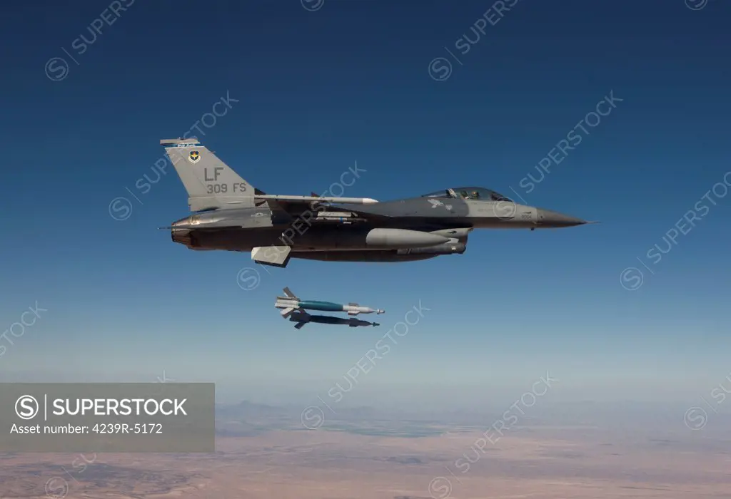 A 56th Fighter Wing F-16 Fighting Falcon from Luke Air Force Base, Arizona, releases two GBU-12 laser guided bombs during a training mission.