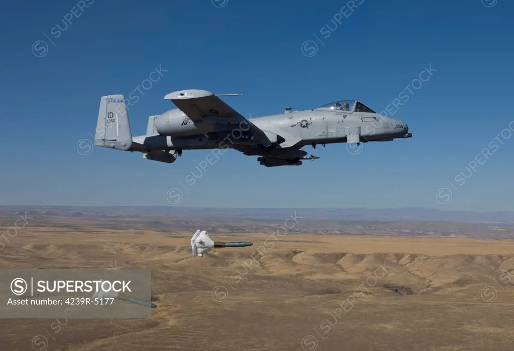 An A-10C Thunderbolt from the 190th Fighter Squadron releases two High Drag BDU-50's during a training mission out of Boise, Idaho.