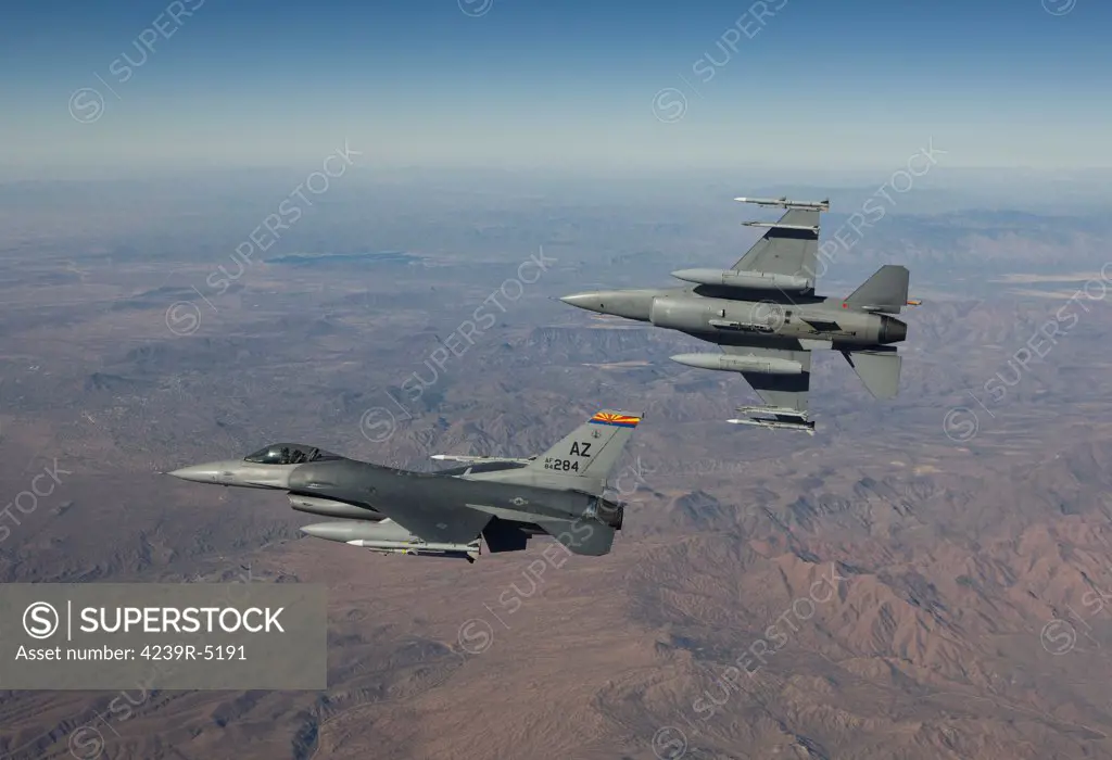A pair of F-16's from the 162nd Fighter Wing fly in formation during a training mission out of Tucson, Arizona.