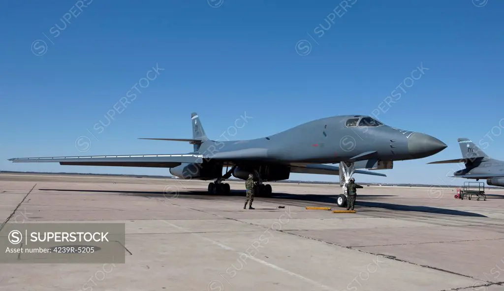 The ground crew is standing by as the aircrew of a 7th Bomb Wing B-1B Lancer goes through pre-flight checks at Dyess Air Force Base, Texas.
