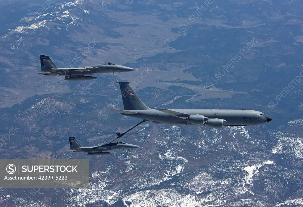 Two F-15 Eagles from the 173rd Fighter Wing conduct air to air refueling training with a KC-135 Stratotanker.