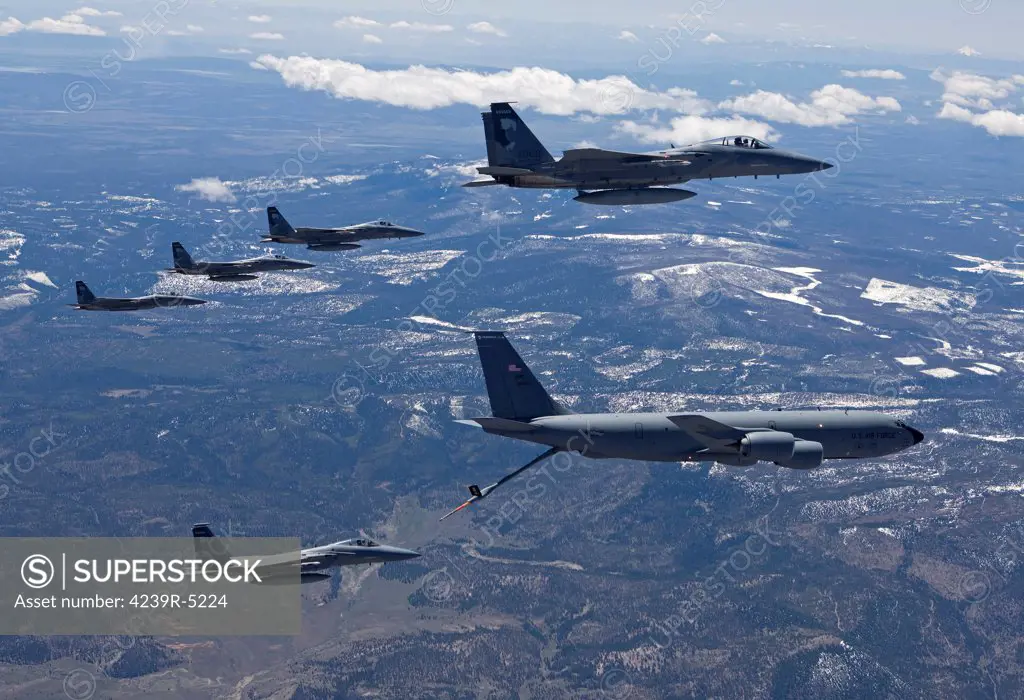 Five F-15 Eagles from the 173rd Fighter Wing conduct air to air refueling training with a KC-135 Stratotanker.