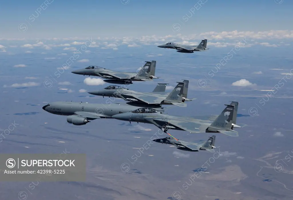 Five F-15 Eagles from the 173rd Fighter Wing conduct air to air refueling training with a KC-135 Stratotanker.