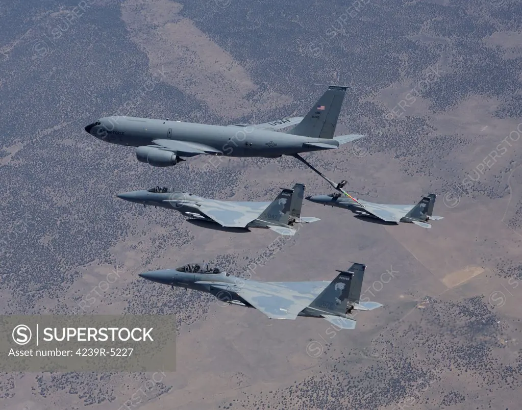 Three F-15 Eagles from the 173rd Fighter Wing conduct air to air refueling training with a KC-135 Stratotanker.