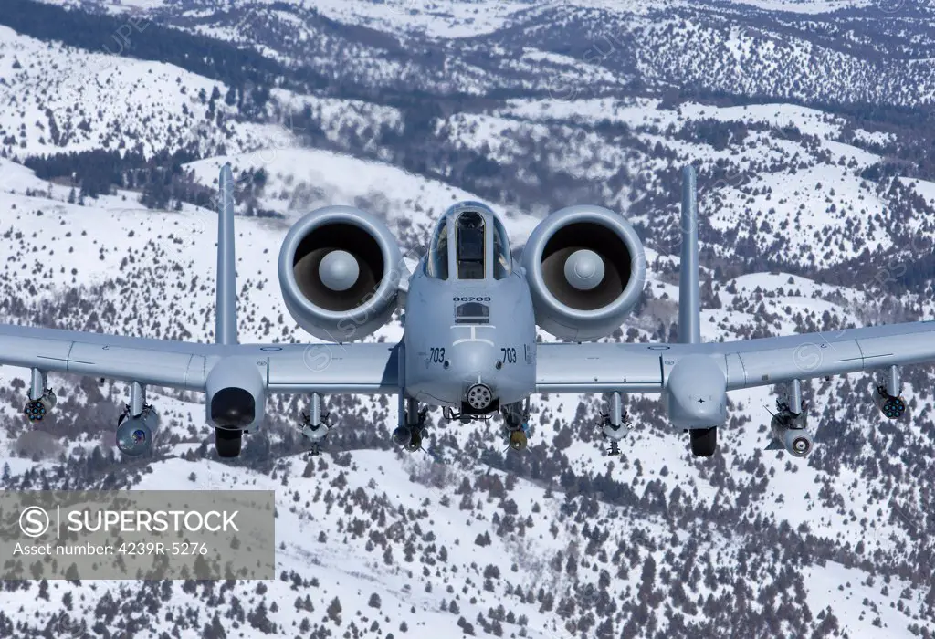 An A-10C Thunderbolt from the 190th Fighter Squadron flies over the snowy Idaho countryside on a training mission out of Boise, Idaho.