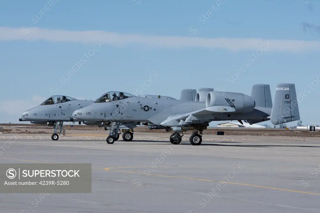 Two A-10 Thunderbolt's from the 190th Fighter Squadron prepare to taxi to the runway on a training mission out of Boise, Idaho.